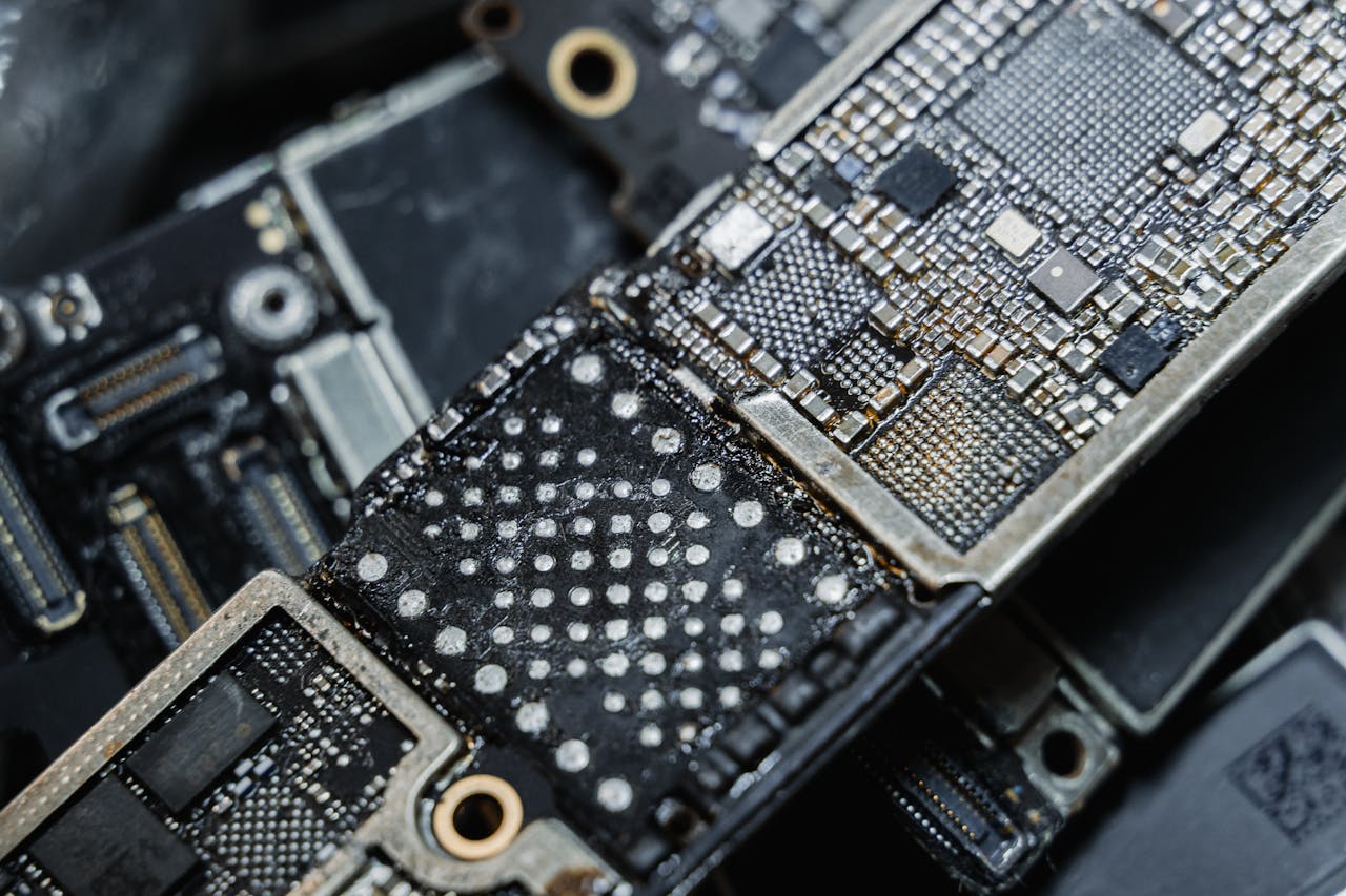 Detailed macro shot of electronic microchip components on a circuit board.
