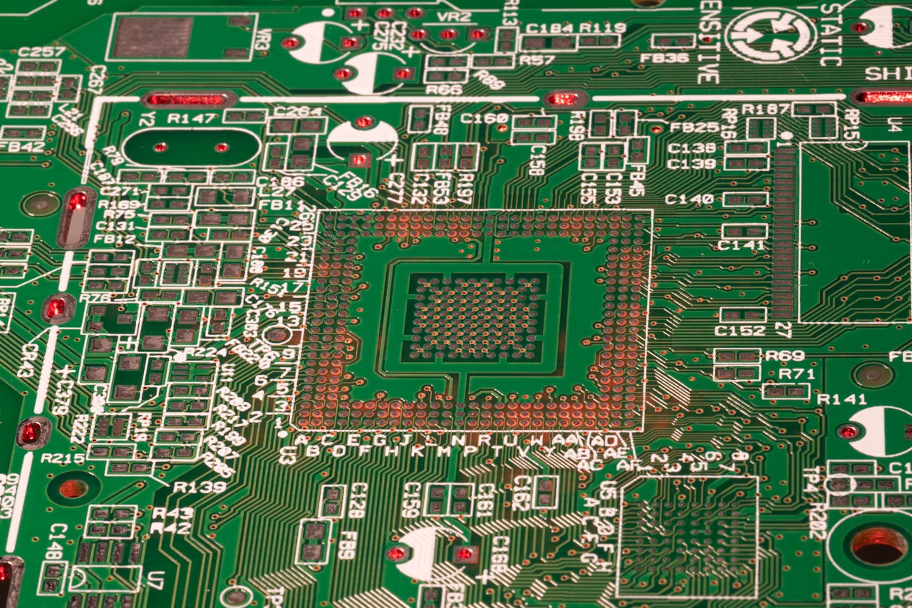 Resources Detailed view of a green printed circuit board with visible components and connections.
